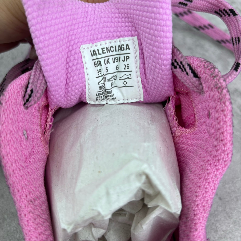 Balenciaga size label inside pink sneaker, showing EUR UK US sizes and origin info
