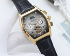 Rolex watch with champagne dial and black leather strap, gold-tone tonneau case