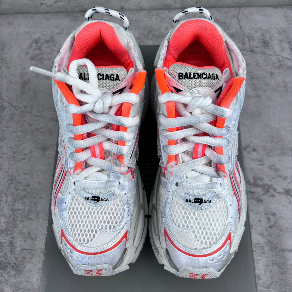 Unisex sneakers front view with red-lined collars, white laces, and BALENCIAGA branding