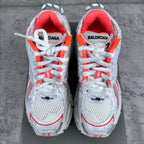 Unisex sneakers front view with red-lined collars, white laces, and BALENCIAGA branding