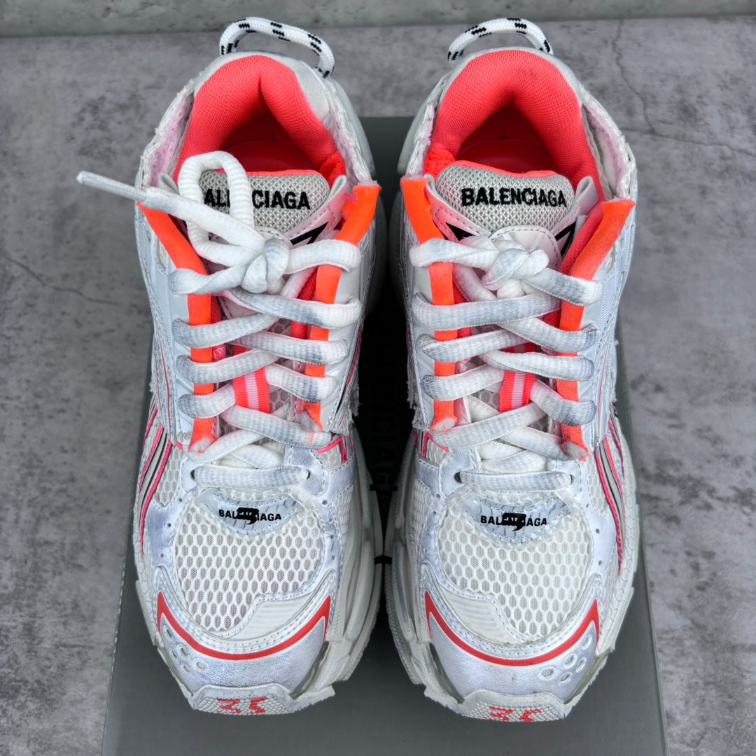 Unisex sneakers front view with red-lined collars, white laces, and BALENCIAGA branding