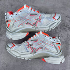 Unisex sneakers pair view with white mesh uppers, red trim, and chunky textured soles