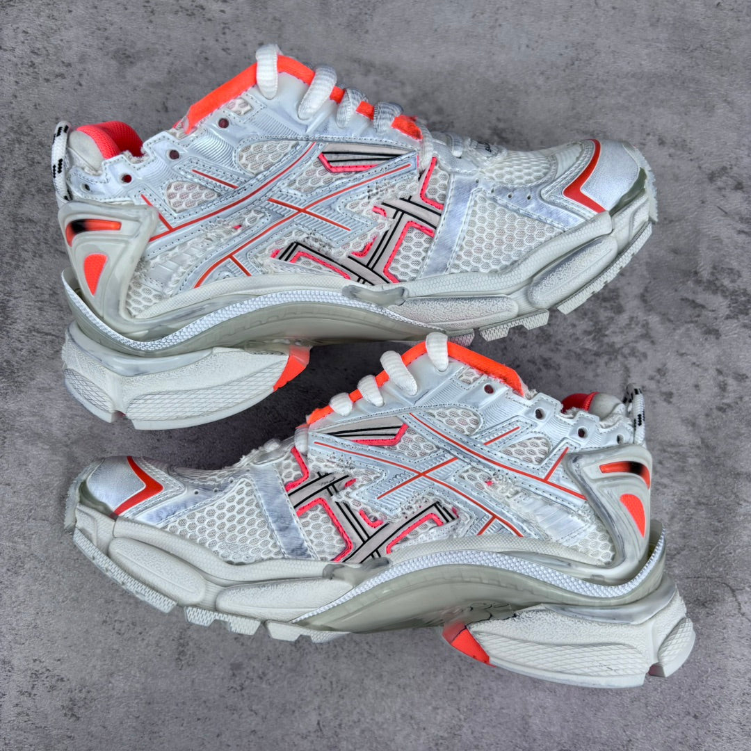 Unisex sneakers pair view with white mesh uppers, red trim, and chunky textured soles