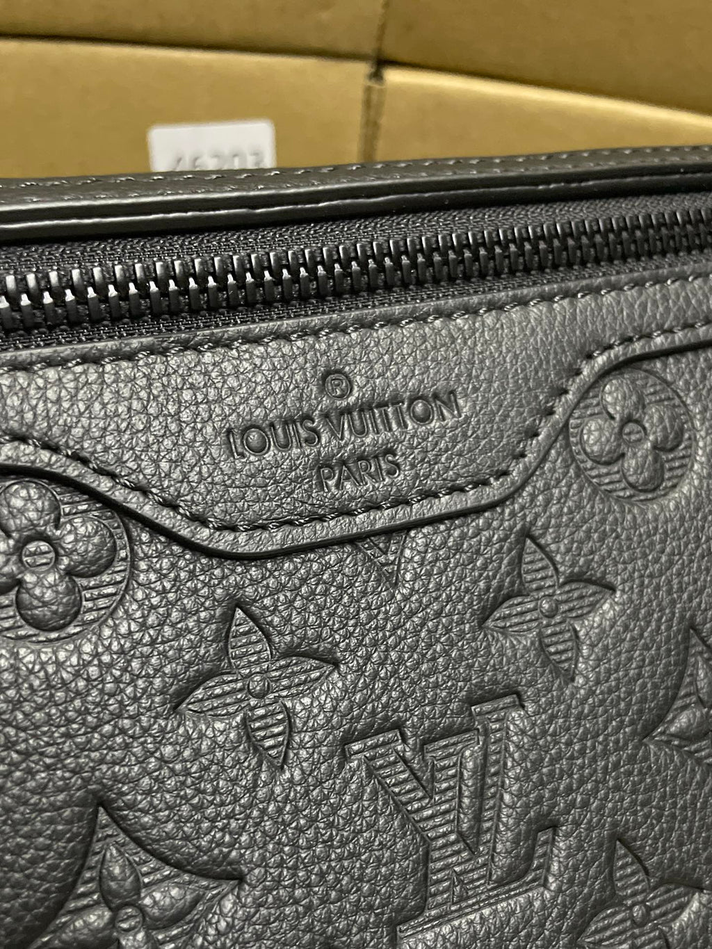 Black monogram leather bag with Louis Vuitton Paris embossed logo