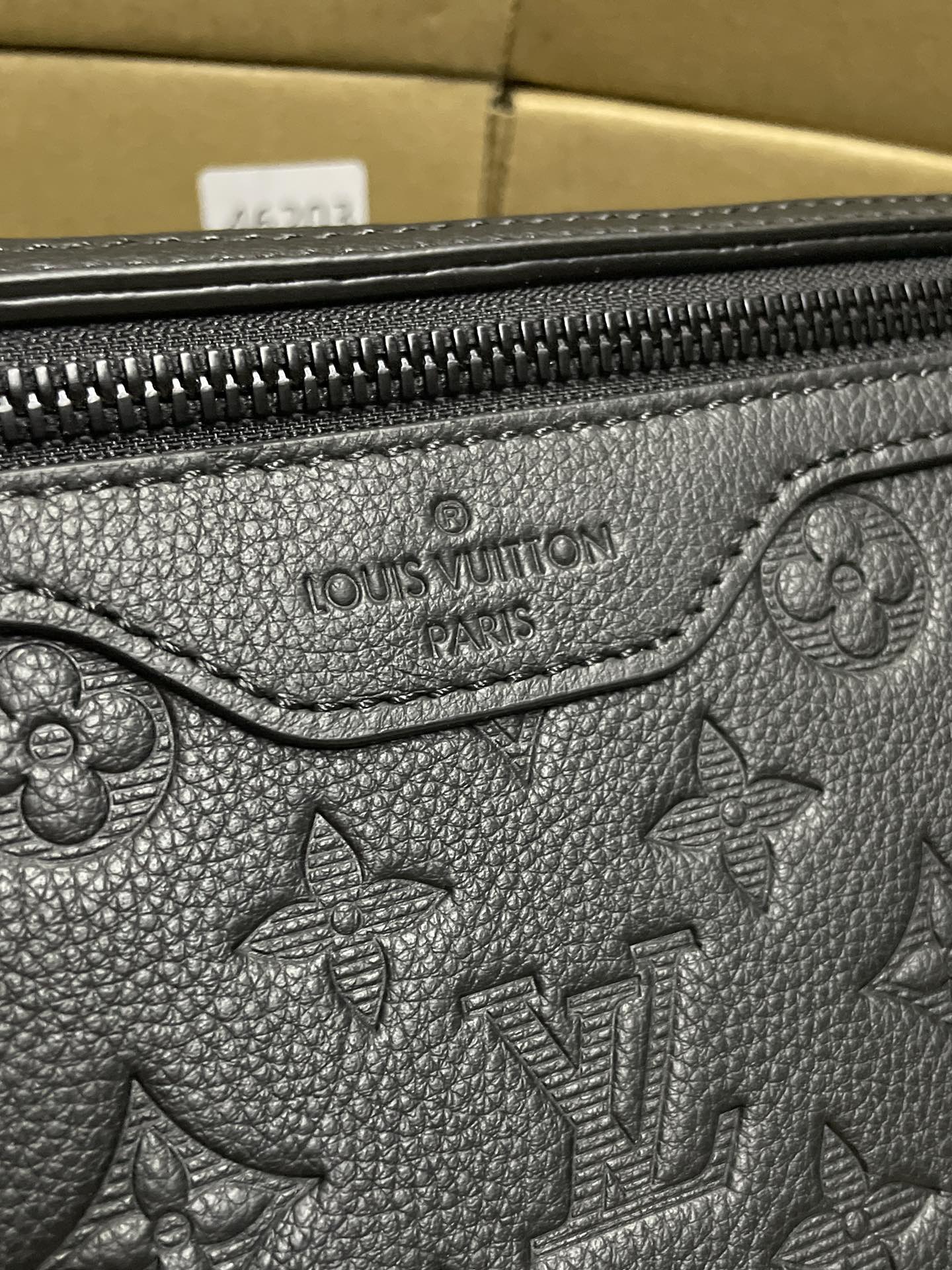 Black monogram leather bag with Louis Vuitton Paris embossed logo
