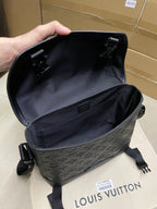 Black monogram crossbody bag open with fabric lining and top hardware