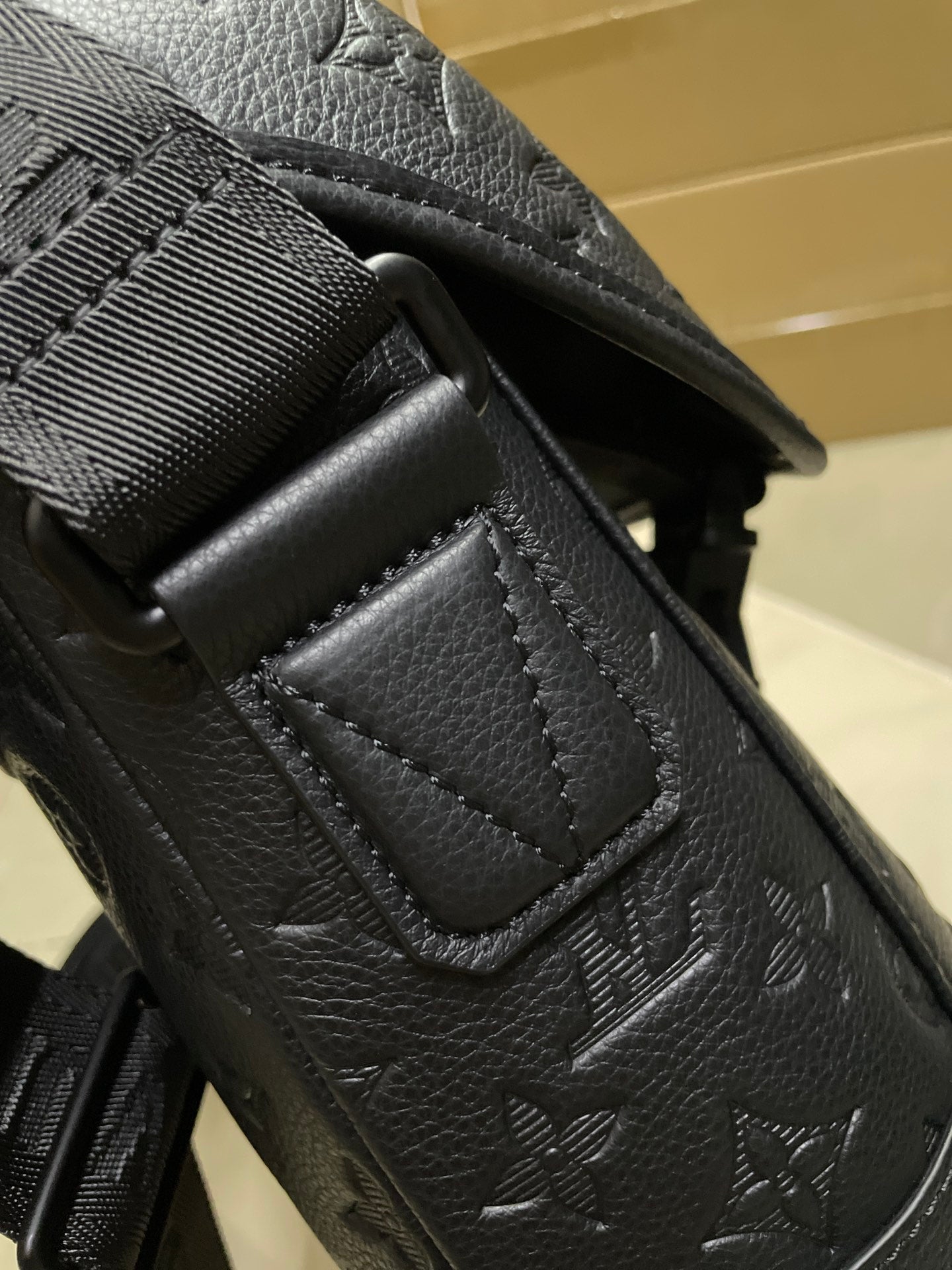 Louis Vuitton men's bag corner and adjustable strap with embossed monogram