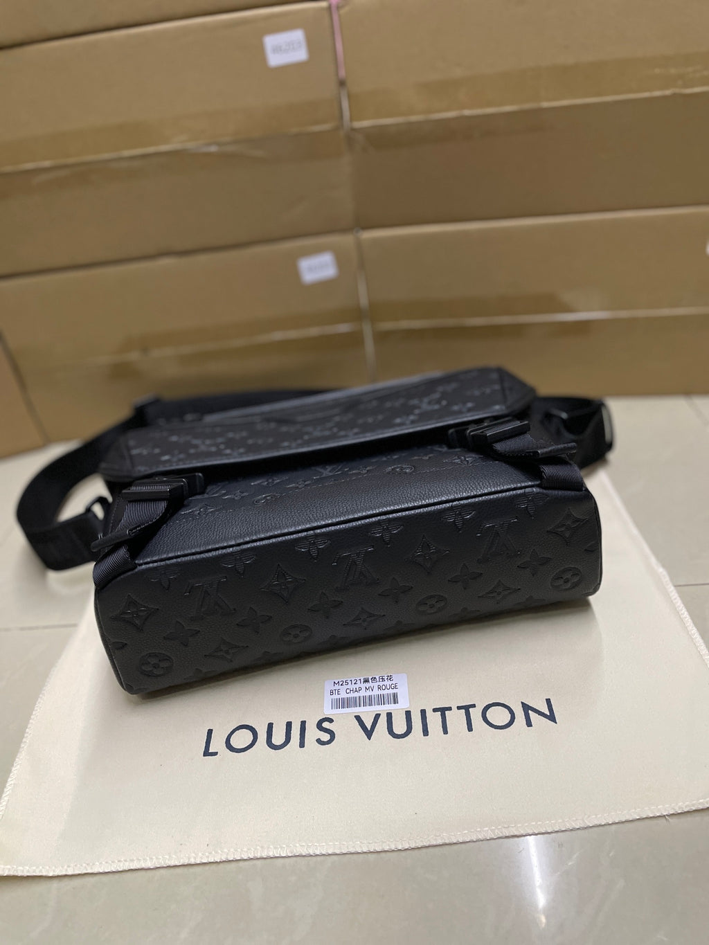 Louis Vuitton men's messenger bag, dark monogram leather with top handle and buckle