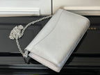 Louis Vuitton silver-gray crossbody bag with chain strap and curved flap edge