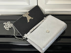 Louis Vuitton silver-gray crossbody bag with chain strap and small button on front