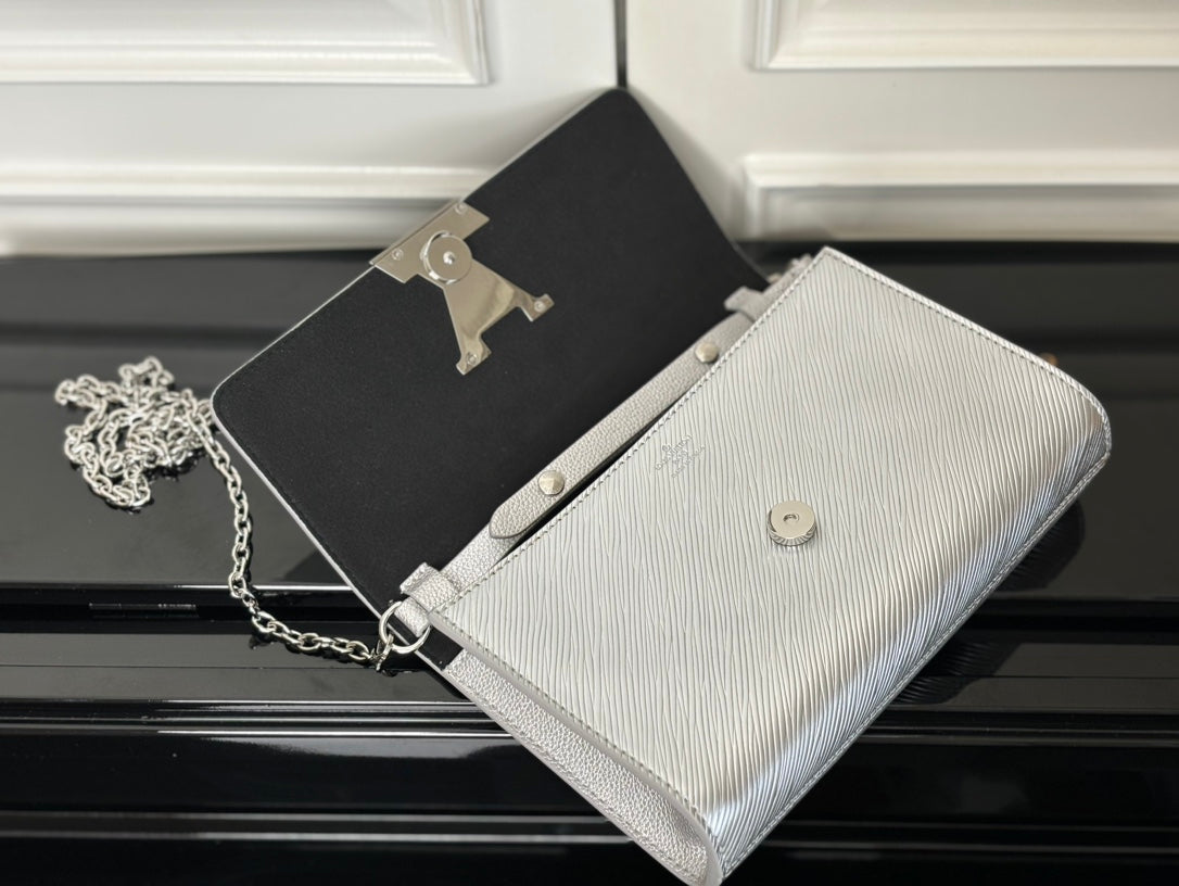 Louis Vuitton silver-gray crossbody bag with chain strap and small button on front