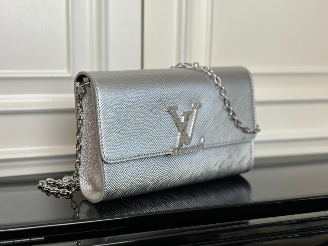 Louis Vuitton small crossbody bag in silver-gray with chain strap and LV logo flap