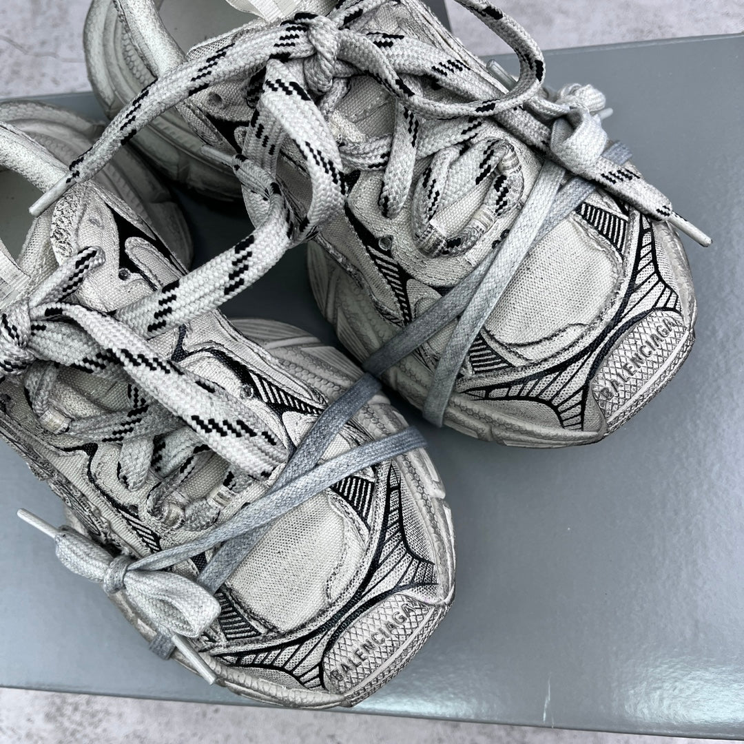 Balenciaga unisex sneakers close-up showing silver mesh panels and laces