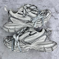 Balenciaga unisex sneakers in silver with black side stripes and blue laces