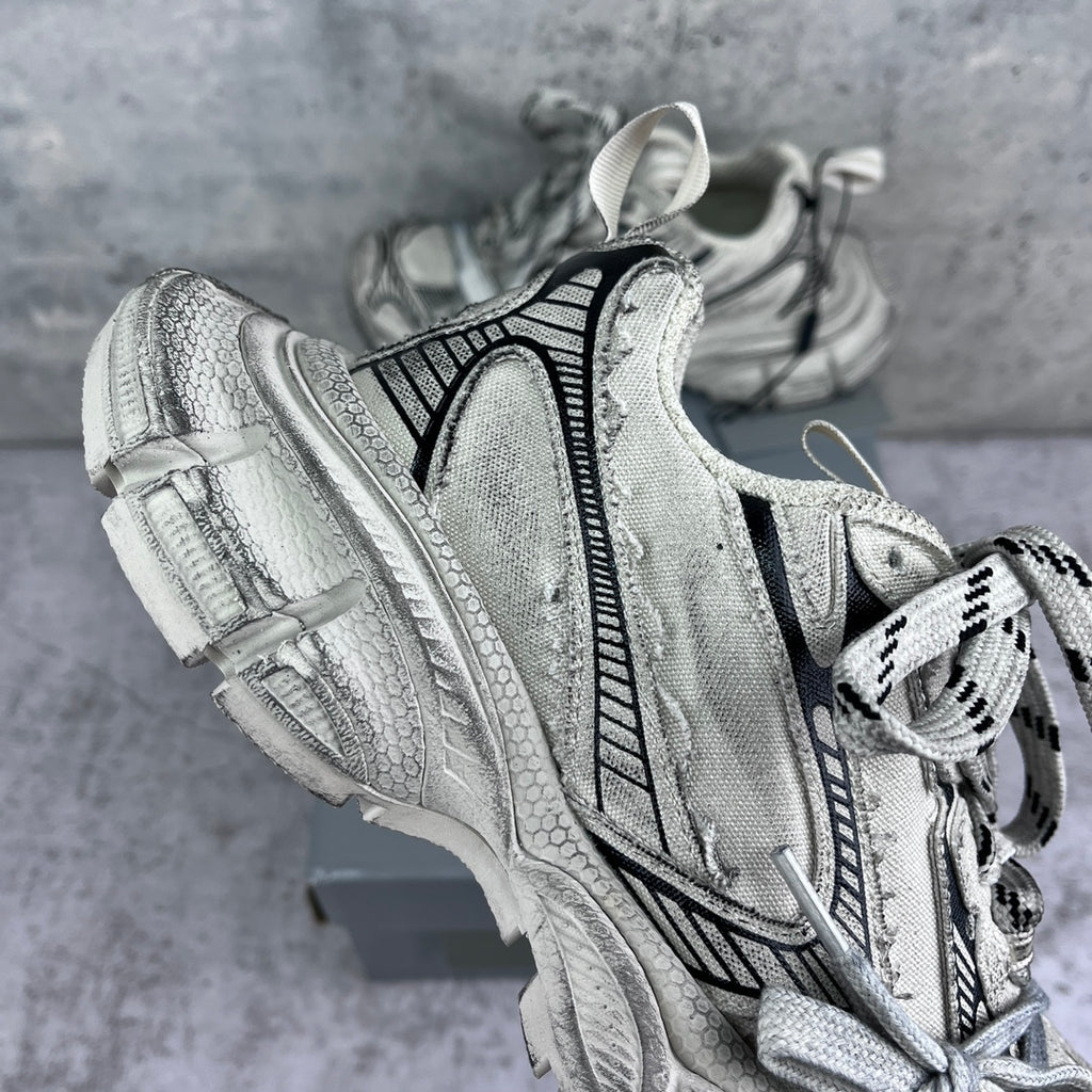 Balenciaga unisex sneakers side view in silver with black vertical stripe