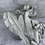 Balenciaga unisex sneakers side view in silver with black vertical stripe