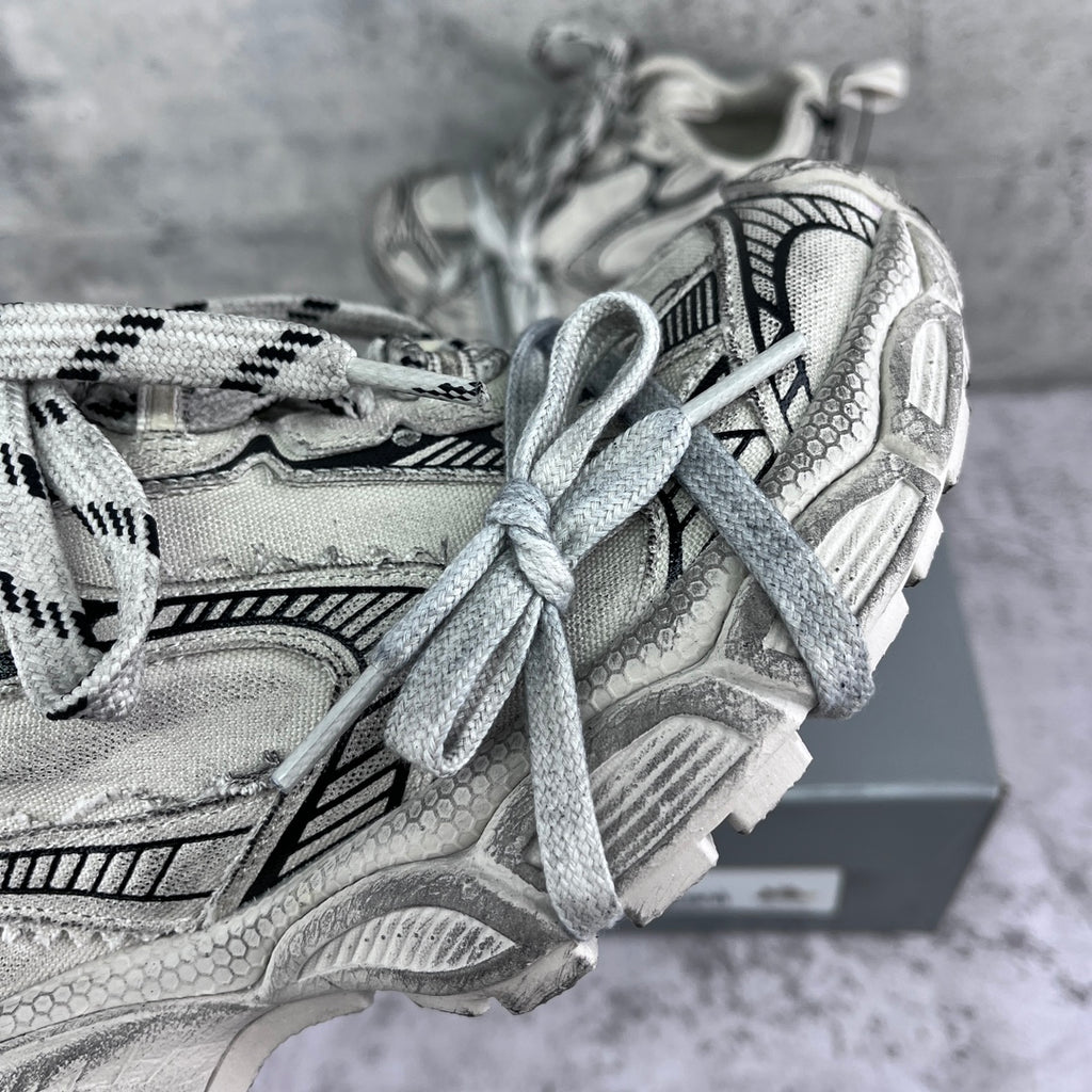 Balenciaga unisex sneakers close-up: silver uppers with patterned laces