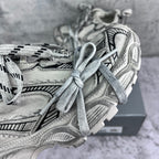 Balenciaga unisex sneakers close-up: silver uppers with patterned laces