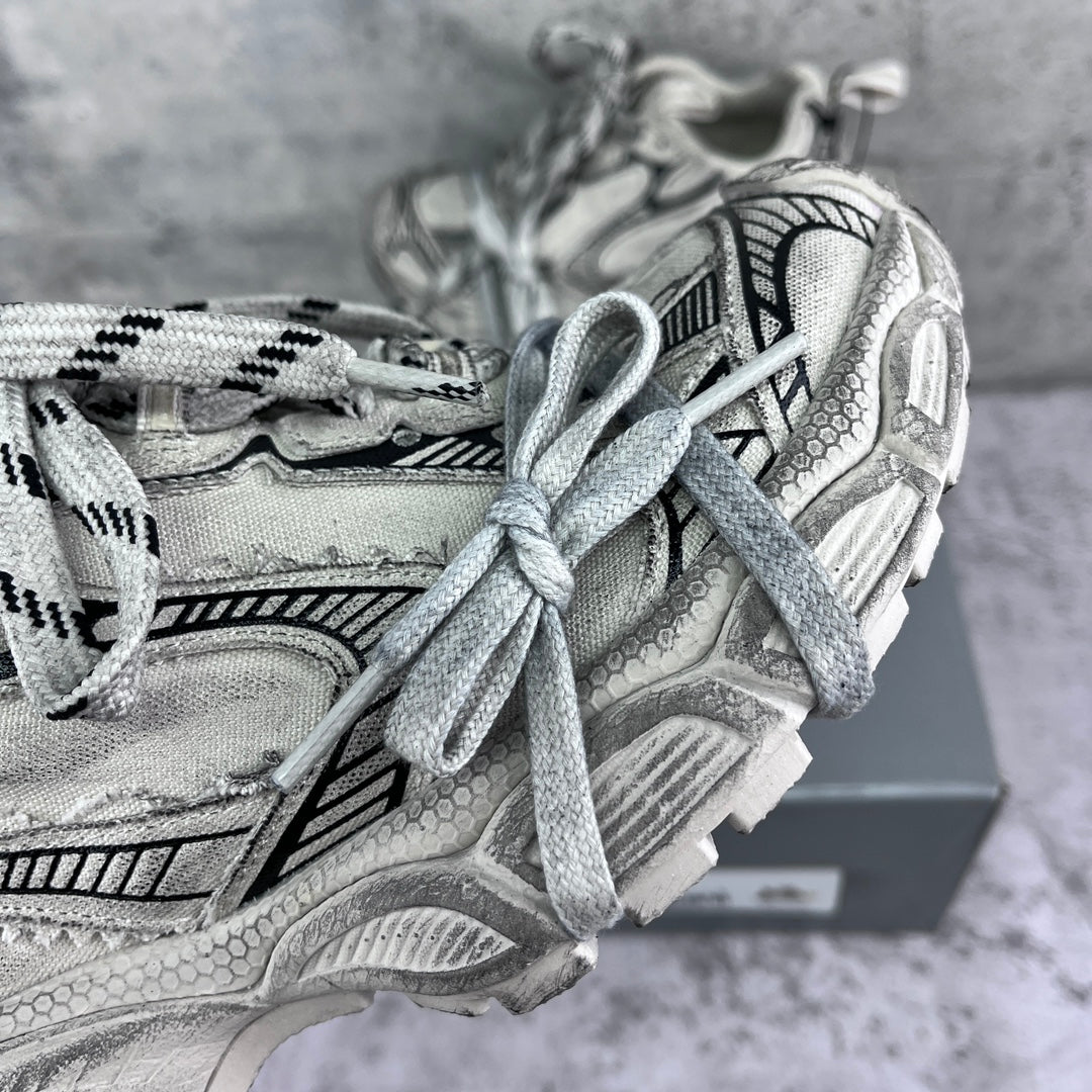 Balenciaga unisex sneakers close-up: silver uppers with patterned laces
