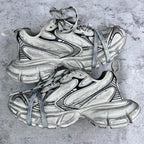 Balenciaga unisex sneakers front view in silver with black trim and blue laces