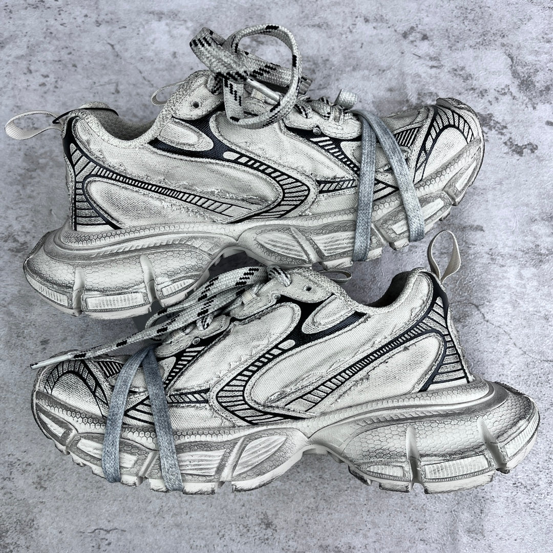 Balenciaga unisex sneakers front view in silver with black trim and blue laces