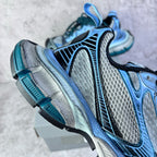 Balenciaga unisex sneakers side view, light blue uppers with black inserts and teal laces