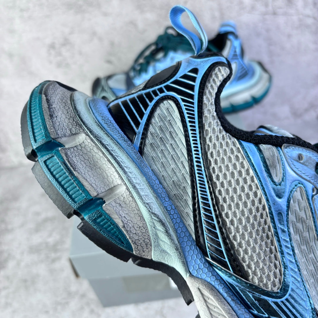 Balenciaga unisex sneakers side view, light blue uppers with black inserts and teal laces