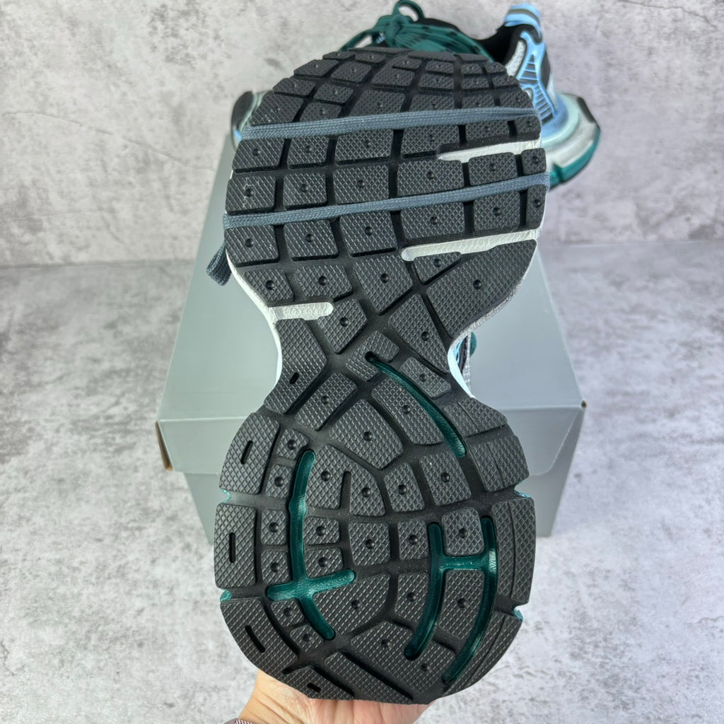 Balenciaga unisex sneaker outsoles, dark rubber tread with teal side accents