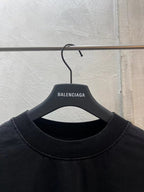 Black Balenciaga T-shirt close-up, crew neck and printed BALENCIAGA logo