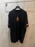 Black Balenciaga short-sleeve T-shirt with orange flame chest graphic and sleeve print