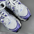 Unisex runner sneakers close-up, white mesh with purple trims and BALENCIAGA branding