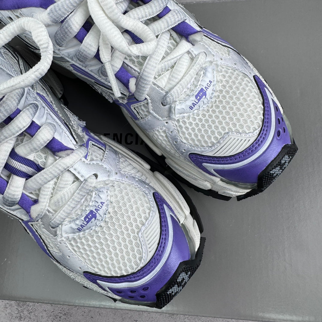 Unisex runner sneakers close-up, white mesh with purple trims and BALENCIAGA branding
