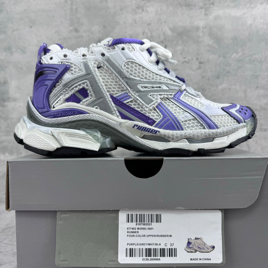 Unisex runner sneakers on box, white and purple with padded collar and thick sole