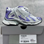 Unisex runner sneakers on box, white and purple with padded collar and thick sole