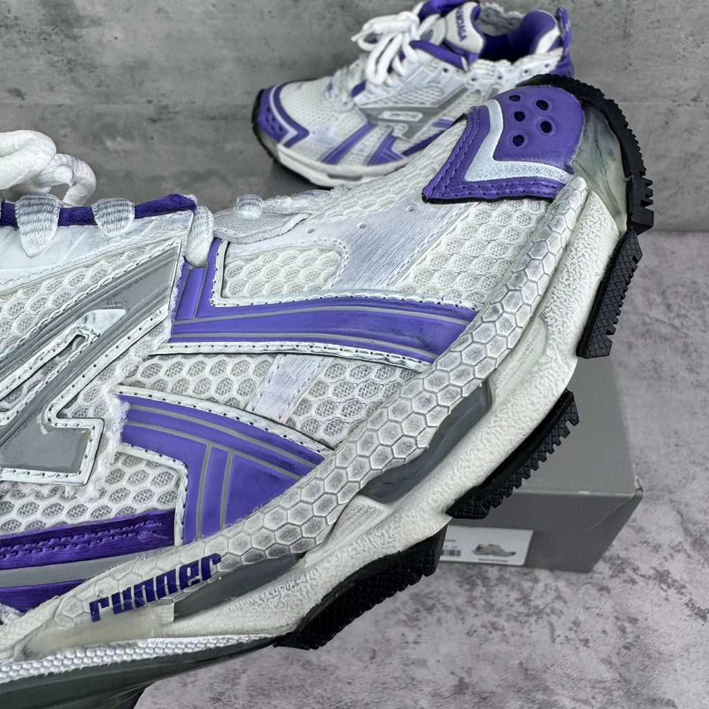 Unisex runner sneakers side view, white textured panels with purple trim and laces