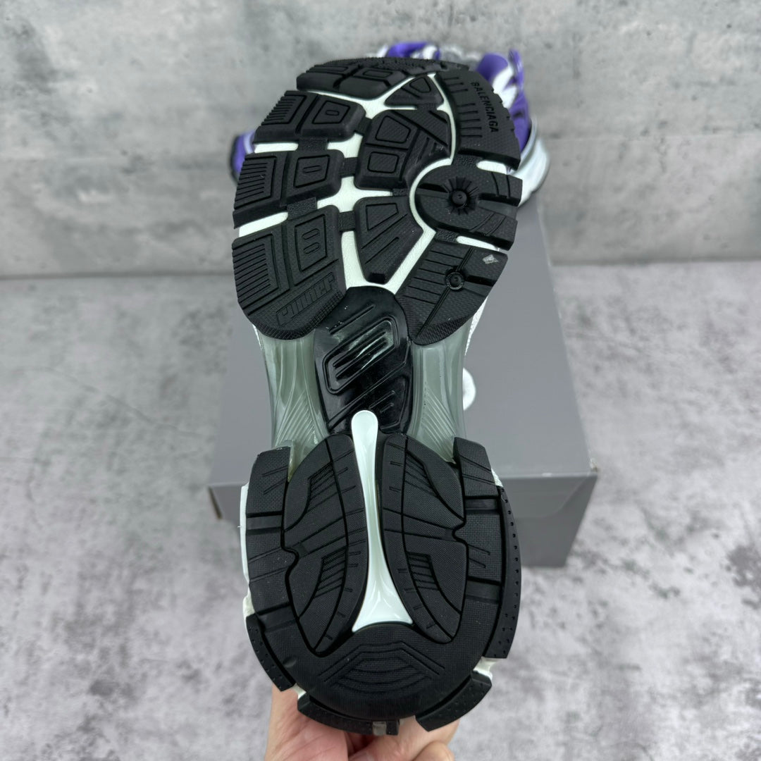 Unisex runner sneakers outsole view, black tread with white and purple upper