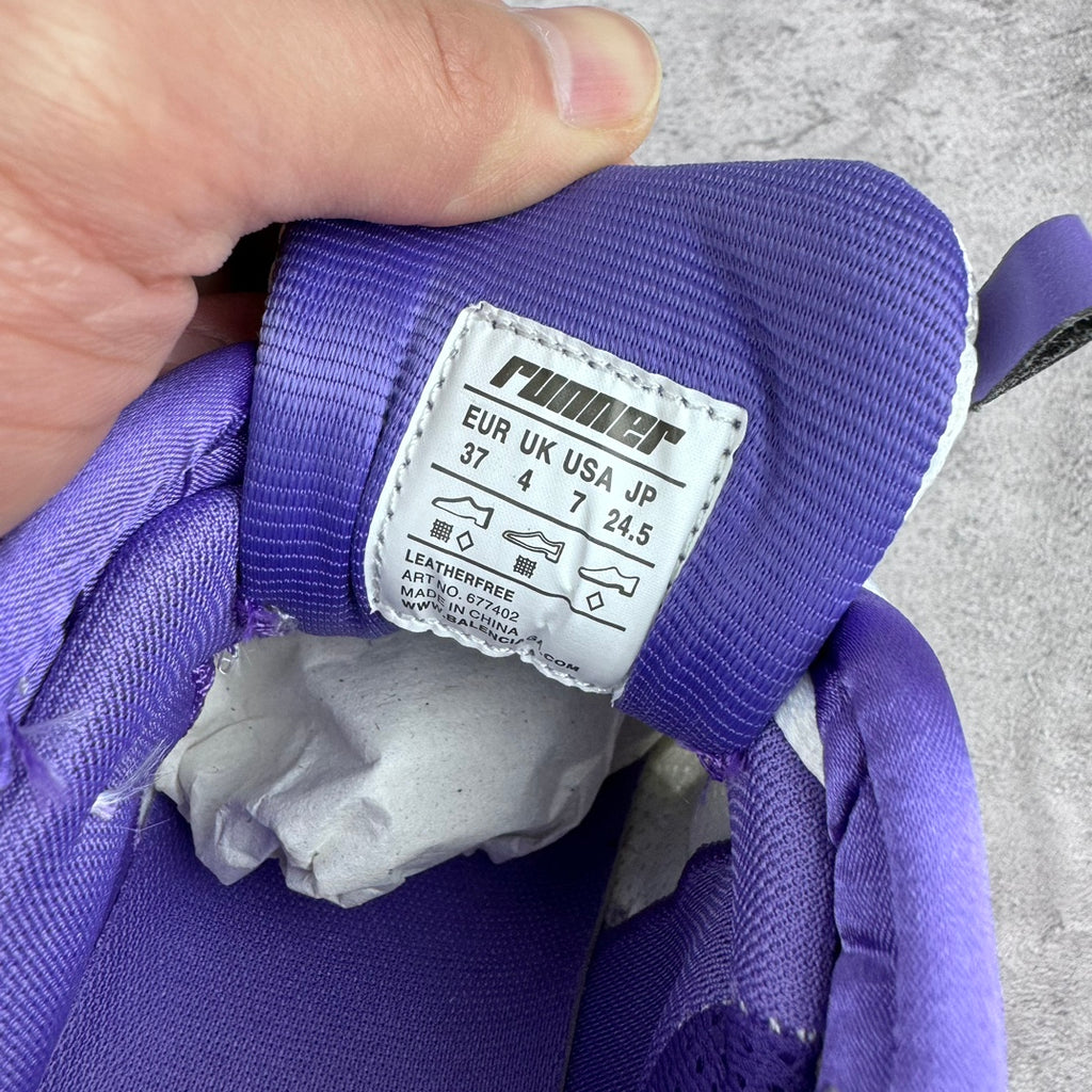 Shoe size tag on purple collar, showing US and EU sizing numbers