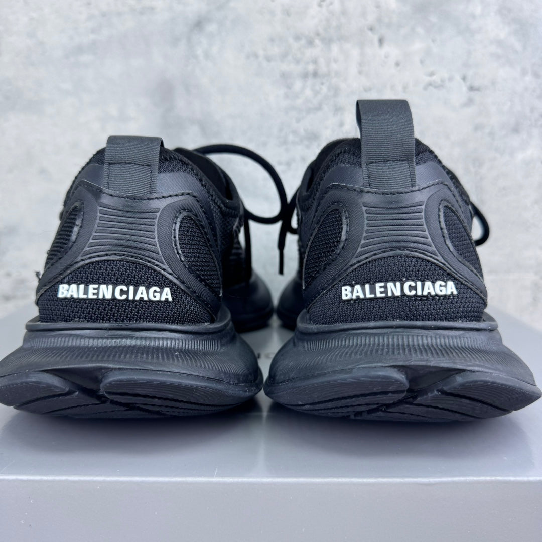 Back view of dark gray/black lace-up unisex sneakers with BALENCIAGA on heel