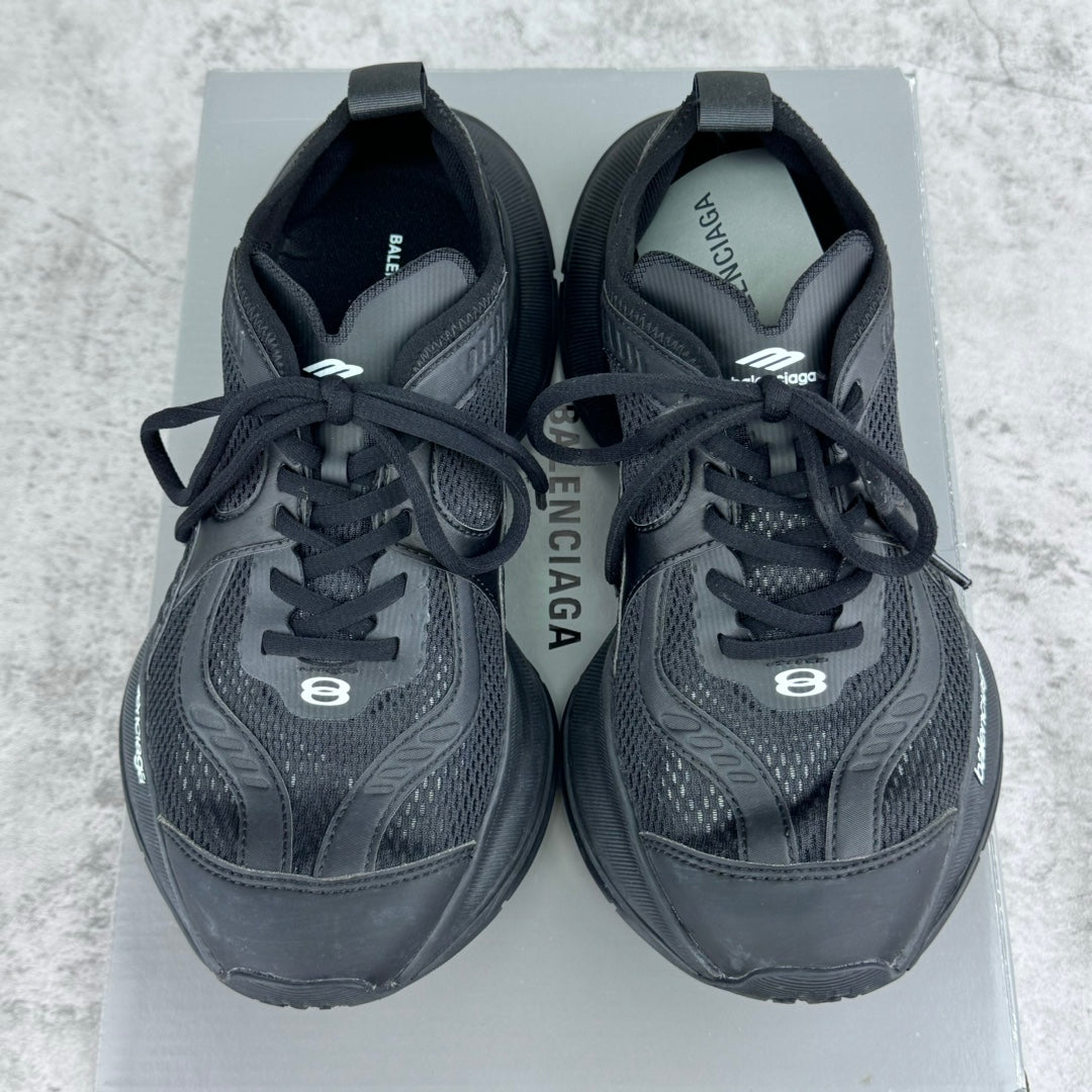 Pair of dark gray/black lace-up unisex sneakers with BALENCIAGA branding on uppers