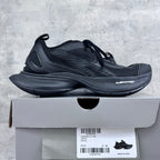 Dark gray/black lace-up unisex sneakers with mesh panels and thick cushioned sole