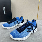 Unisex blue knit sneakers with dark navy laces, black tongue patch, and white sole