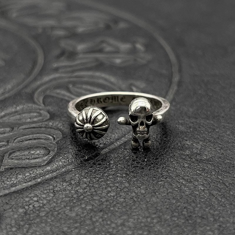 Silver-tone ring with skull head and flower emblem
