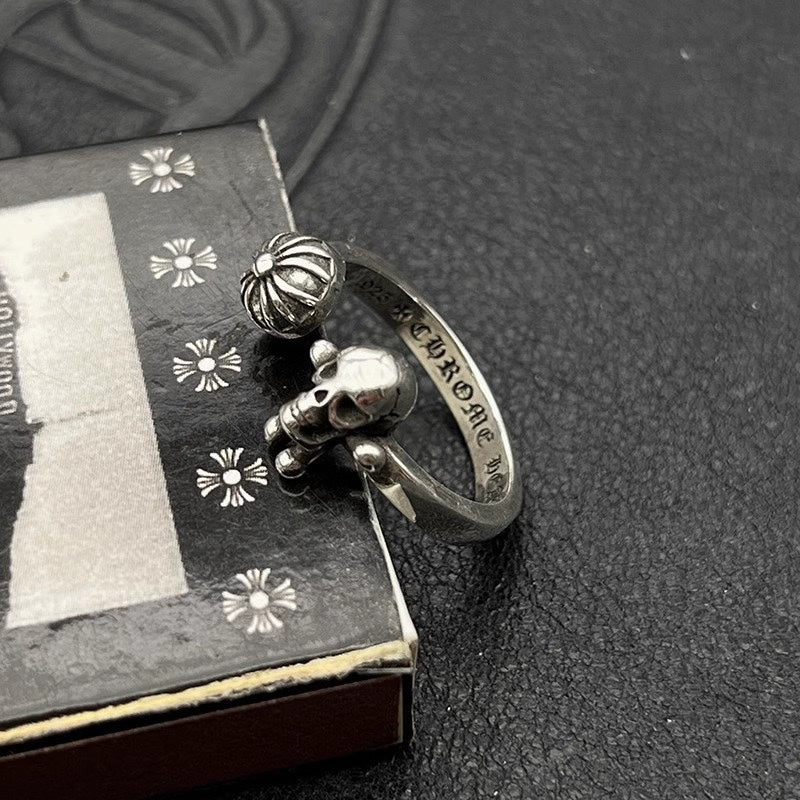 Silver-tone ring with engraved nameplate and skull charm