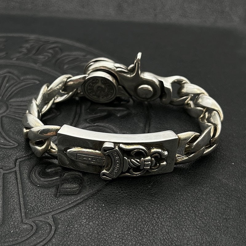 Silver-tone chain bracelet with clasp and engraved central rectangular plate