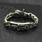 Silver-tone chain bracelet with clasp and engraved central rectangular plate