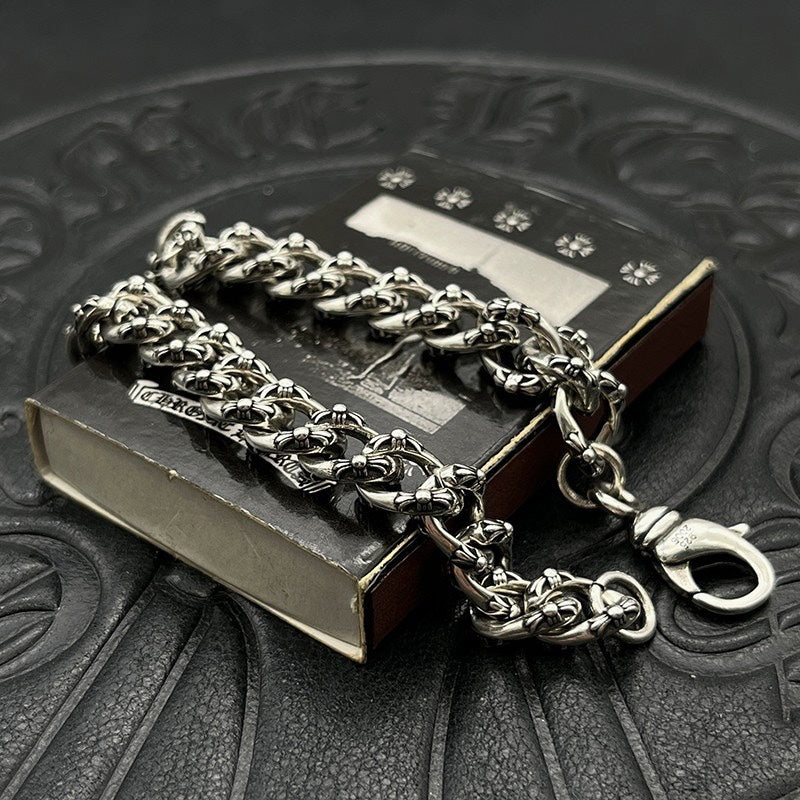 Chrome bracelet with silver-toned curb chain and ring clasp