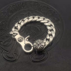 Silver-toned circular bracelet with twisted chain links and three flower charm accents