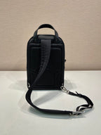 Black Prada mini backpack, top handle and adjustable crossbody strap, textured back panel