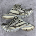 Balenciaga unisex sneakers pair with lace-up straps, mesh panels, and chunky rubber sole