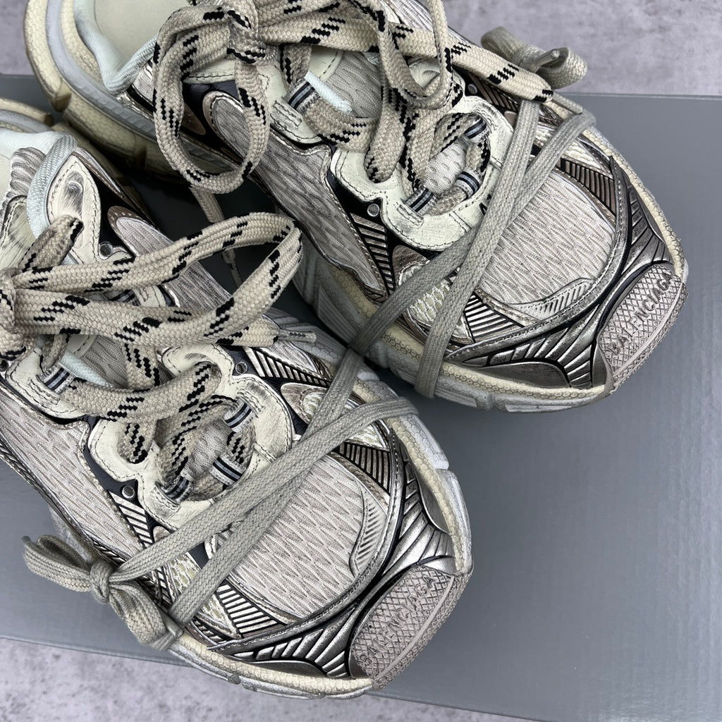 Balenciaga unisex sneakers close-up showing lace-up straps and patterned panels